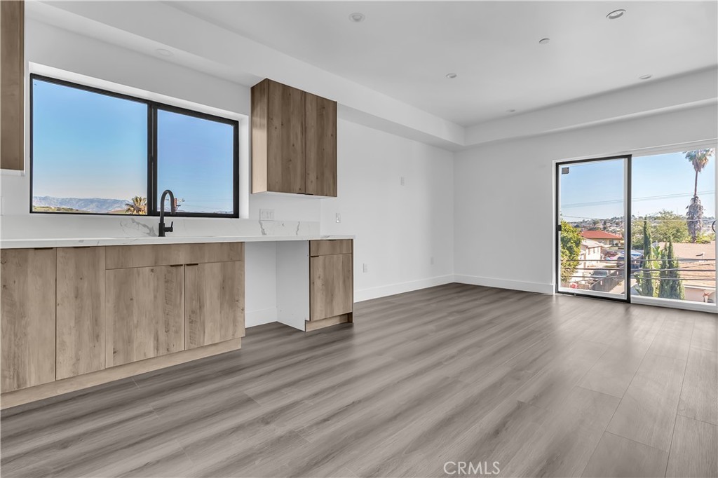 1571 Ricardo Street Los Angeles, CA 90033 - Photo 11 of 18 a view of an empty room with wooden floor and a window