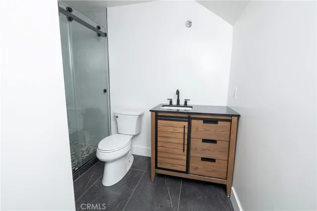a bathroom with a toilet and a sink