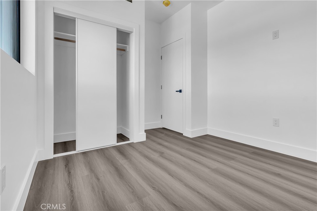 1571 Ricardo Street Los Angeles, CA 90033 - Photo 17 of 18 a view of an empty room with wooden floor