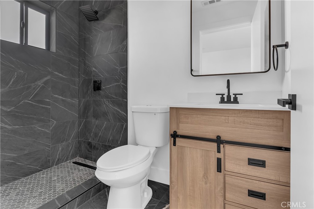 1571 Ricardo Street Los Angeles, CA 90033 - Photo 6 of 18 a bathroom with a sink toilet and shower