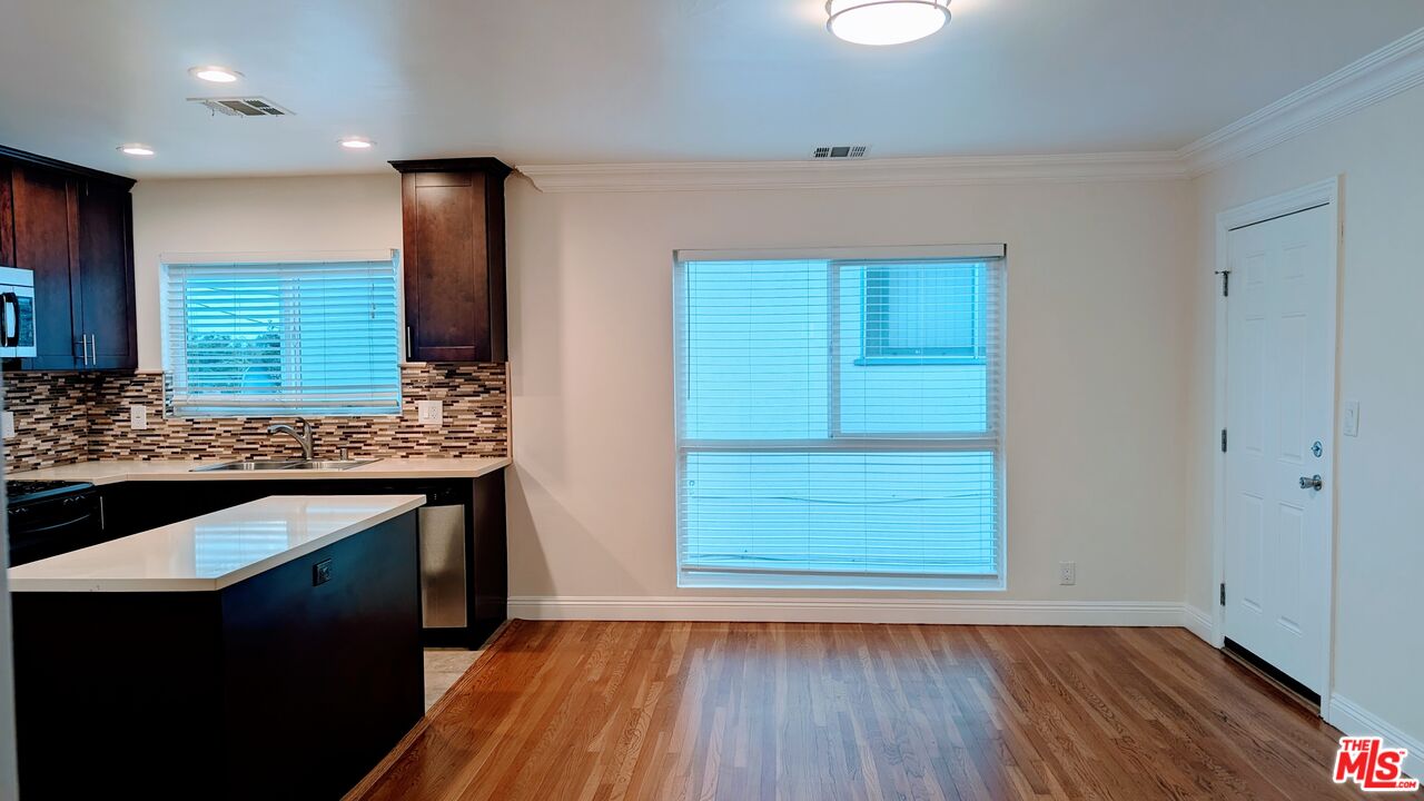 1728 South Robertson Boulevard, Unit 8 Los Angeles, CA 90035 - Photo 5 of 10 a kitchen with a sink and wooden floor