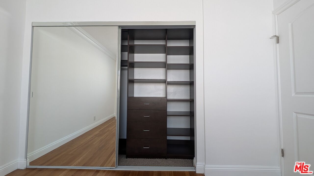 1728 South Robertson Boulevard, Unit 8 Los Angeles, CA 90035 - Photo 6 of 10 a view of walk in closet with empty racks
