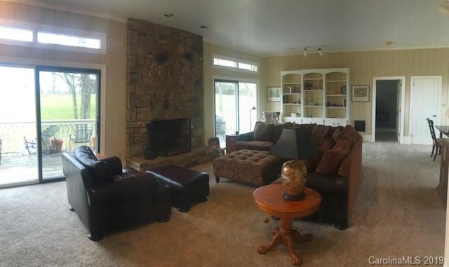 212 Pine Ridge Road Beech Mountain, NC 28604 - Photo 13 of 27 a living room with furniture and a large window
