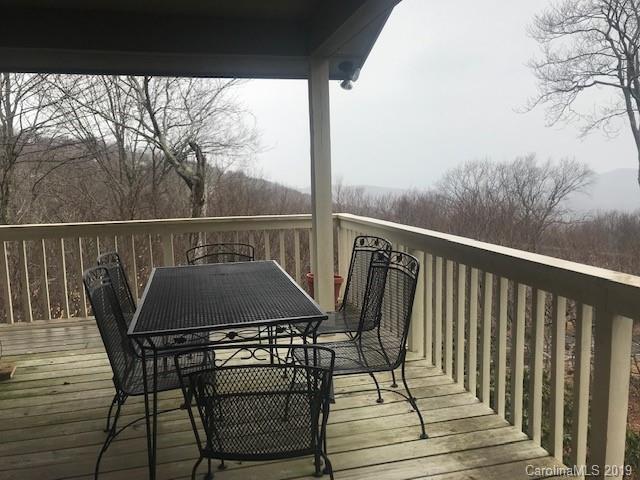 212 Pine Ridge Road Beech Mountain, NC 28604 - Photo 17 of 27 a view of a balcony with furniture