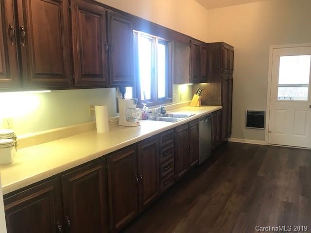 212 Pine Ridge Road Beech Mountain, NC 28604 - Photo 19 of 27 a kitchen with a sink a window and cabinets