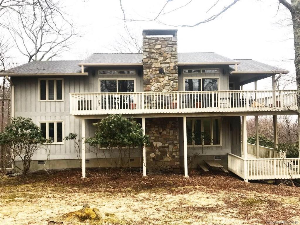 212 Pine Ridge Road Beech Mountain, NC 28604 - Photo 3 of 27 a front view of a house with a porch