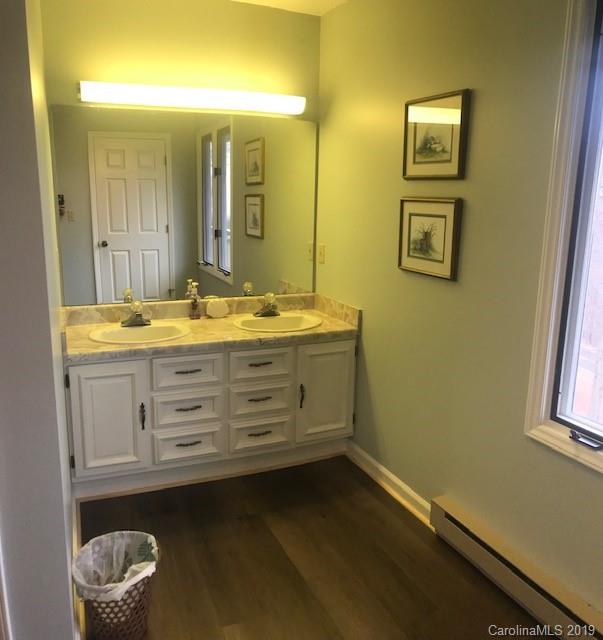 212 Pine Ridge Road Beech Mountain, NC 28604 - Photo 21 of 27 a bathroom with a sink and a mirror