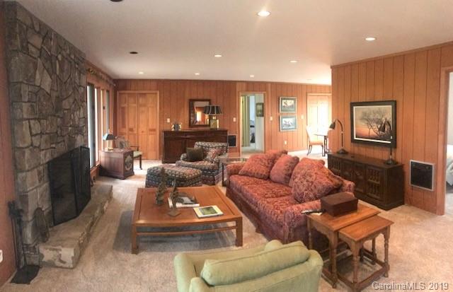 212 Pine Ridge Road Beech Mountain, NC 28604 - Photo 24 of 27 a living room with furniture and a fireplace
