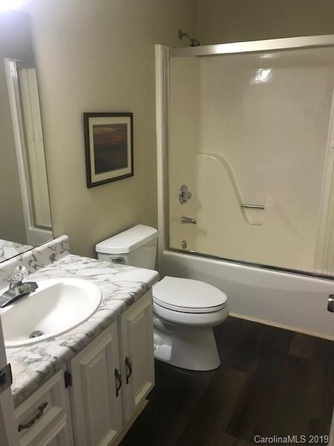 212 Pine Ridge Road Beech Mountain, NC 28604 - Photo 27 of 27 a bathroom with a granite countertop sink toilet and shower