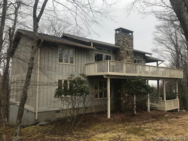 212 Pine Ridge Road Beech Mountain, NC 28604 - Photo 5 of 27 a front view of a house with garden
