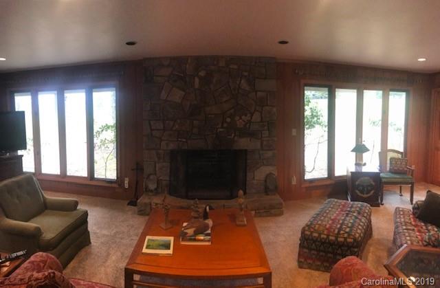 212 Pine Ridge Road Beech Mountain, NC 28604 - Photo 9 of 27 a living room with furniture and a fireplace