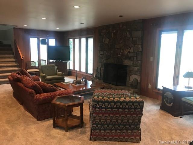 212 Pine Ridge Road Beech Mountain, NC 28604 - Photo 10 of 27 a living room with furniture and a fireplace