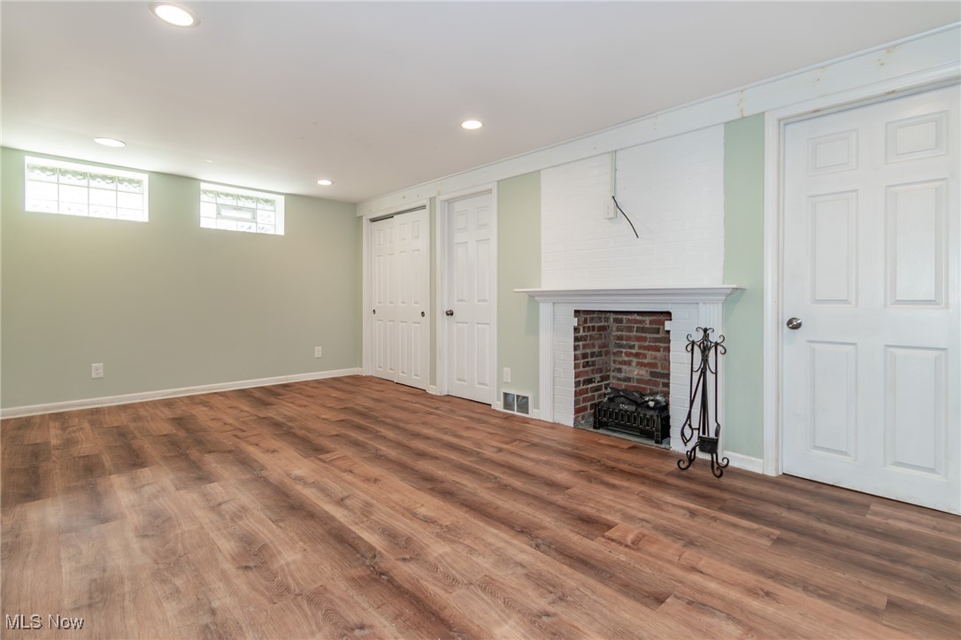 5195 Mayview Road Cleveland, OH 44124 - Photo 49 of 49 Below grade area with wood finished floors, recessed lighting, and a Electric fireplace