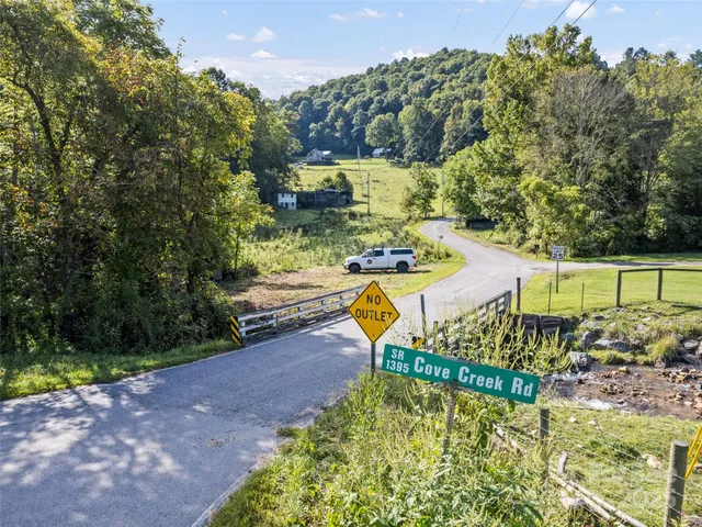 a sign broad in the middle of a park