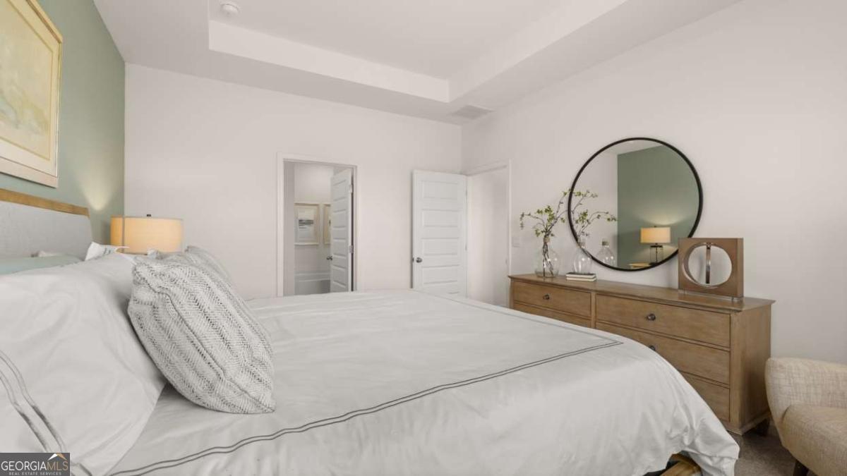 111 Cattle Drive Perry, GA 31069 - Photo 11 of 47 a bedroom with a bed and a mirror