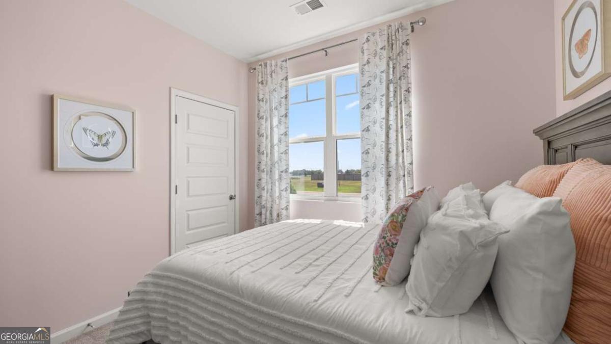 111 Cattle Drive Perry, GA 31069 - Photo 31 of 47 a bedroom with a bed and a window