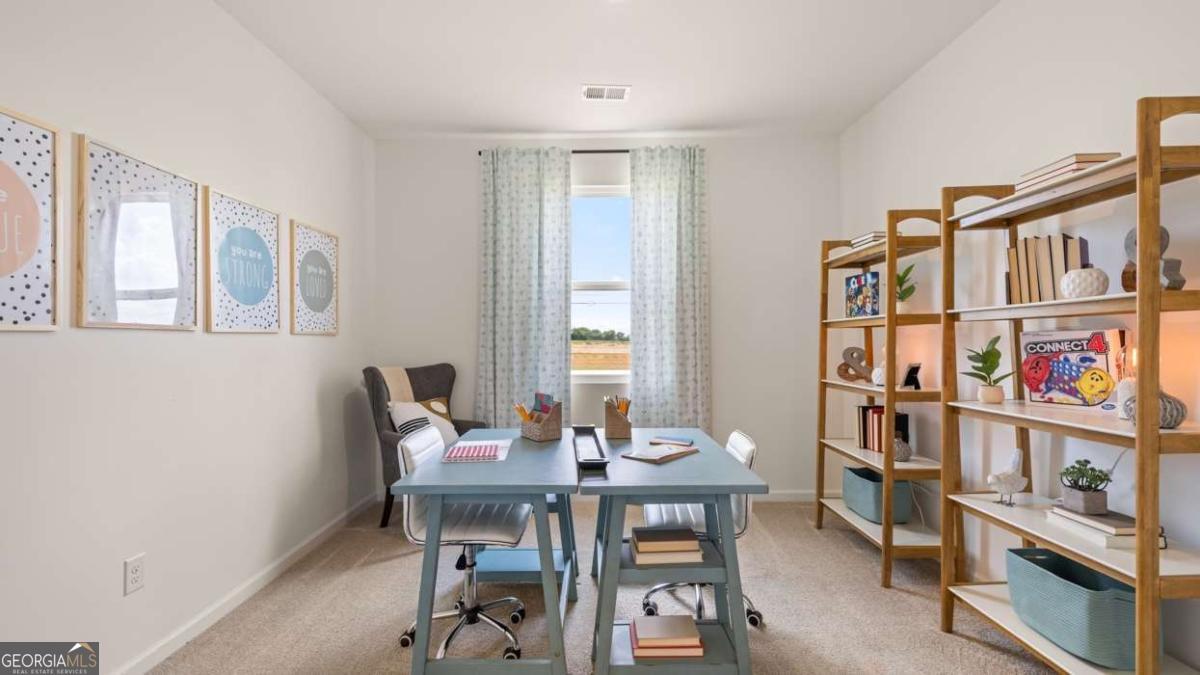111 Cattle Drive Perry, GA 31069 - Photo 37 of 47 a view of a dining room with furniture and a book shelf