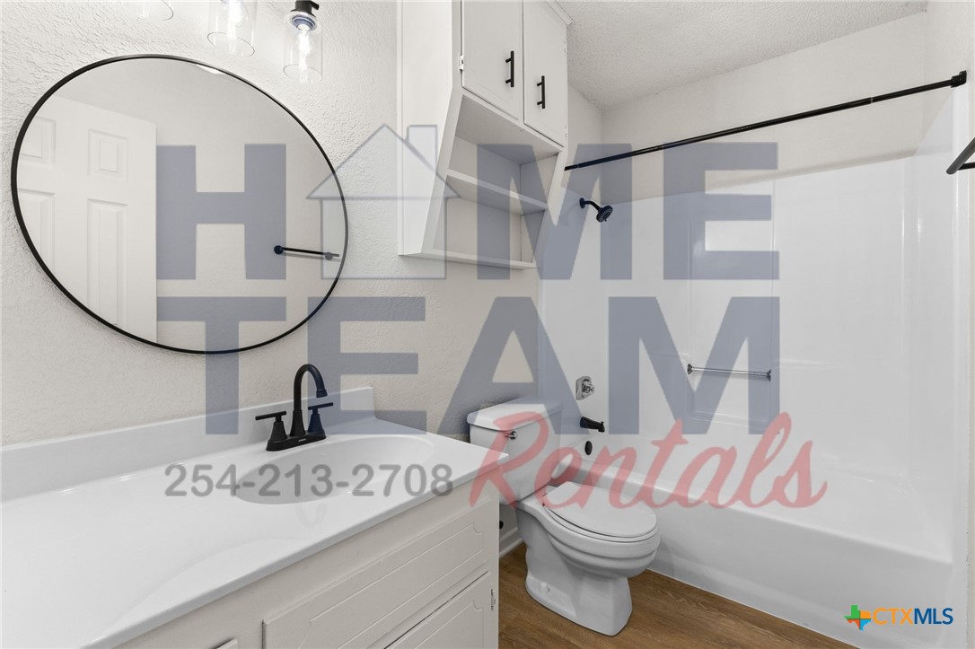 1005 Eastside Drive, Unit B Killeen, TX 76543 - Photo 9 of 11 a bathroom with a sink and a mirror