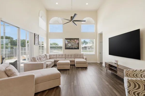 a living room with furniture and a large window