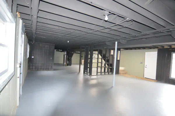 a view of gallery with wooden floor