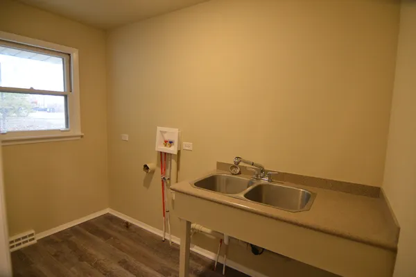 a white toilet sitting next to a bathroom sink