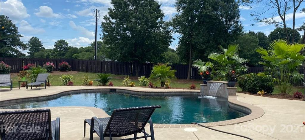103 Webbed Foot Road Mooresville, NC 28117 - Photo 2 of 6 a view of a swimming pool with sitting area