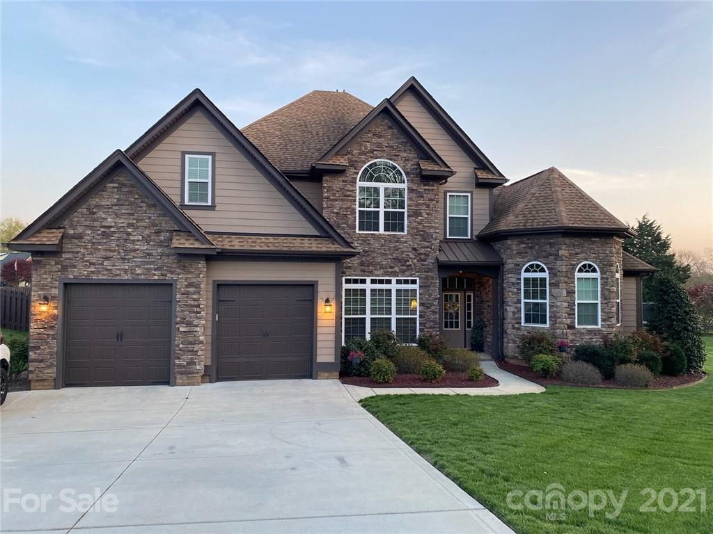 103 Webbed Foot Road Mooresville, NC 28117 - Photo 5 of 6 a front view of a house with a yard and garage