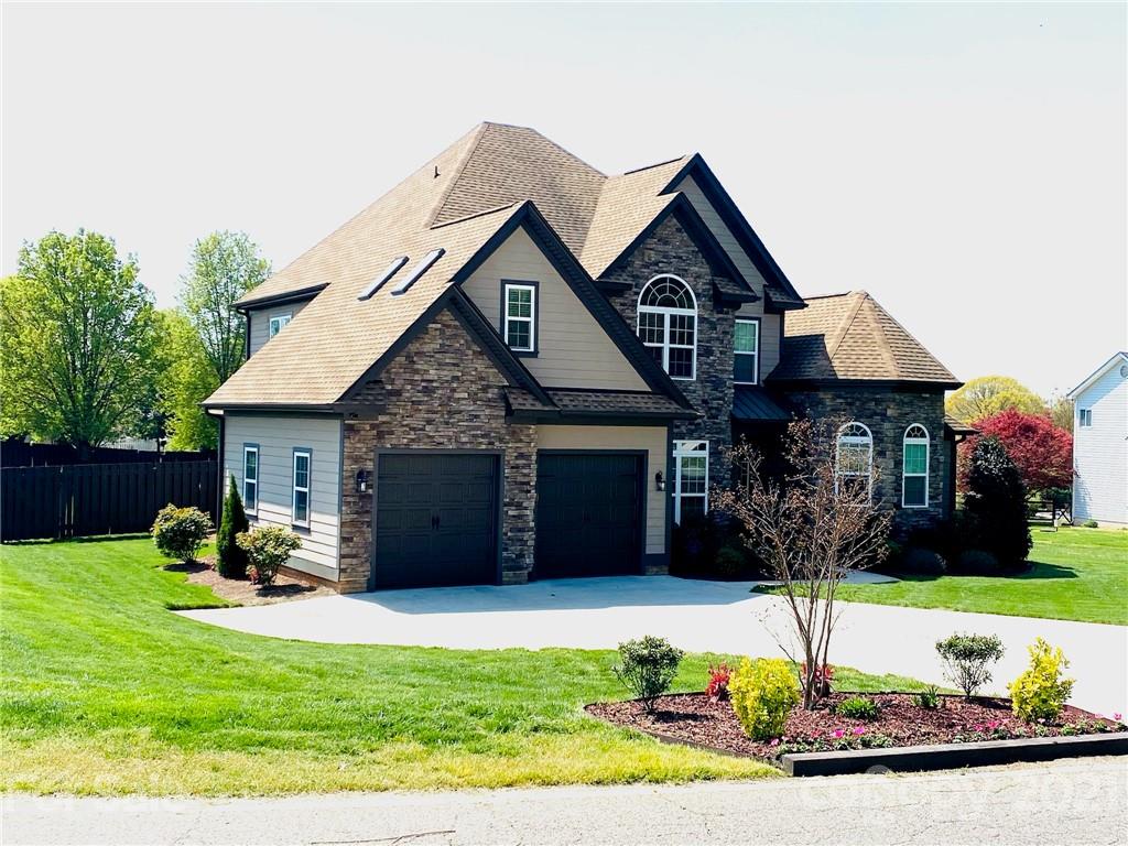 103 Webbed Foot Road Mooresville, NC 28117 - Photo 6 of 6 a front view of a house with a yard