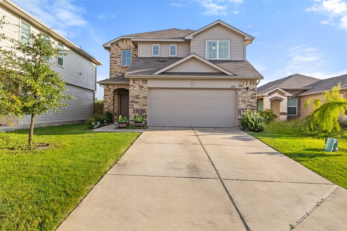 a front view of a house with a yard