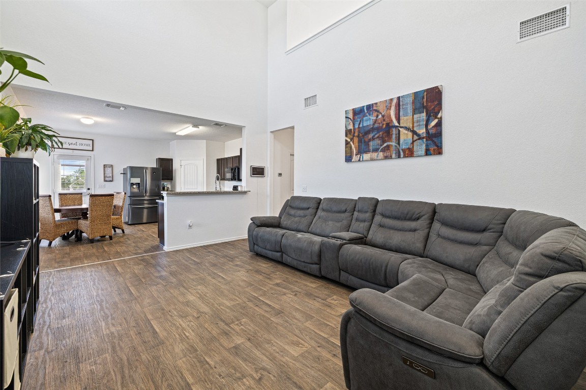 11801 Riprap Drive Manor, TX 78653 - Photo 11 of 40 a living room with furniture and kitchen view