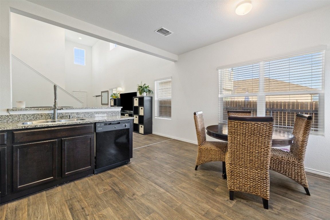 11801 Riprap Drive Manor, TX 78653 - Photo 17 of 40 a kitchen with a sink cabinets and wooden floor