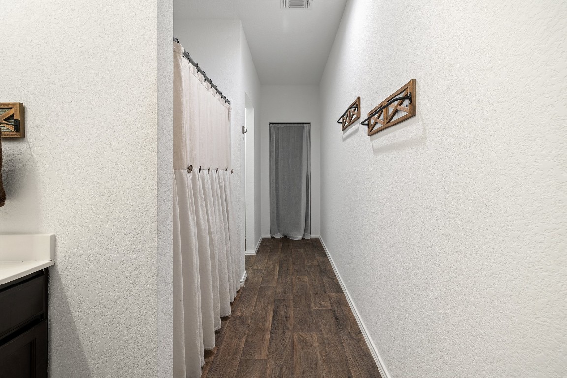 11801 Riprap Drive Manor, TX 78653 - Photo 24 of 40 a view of a hallway with wooden floor