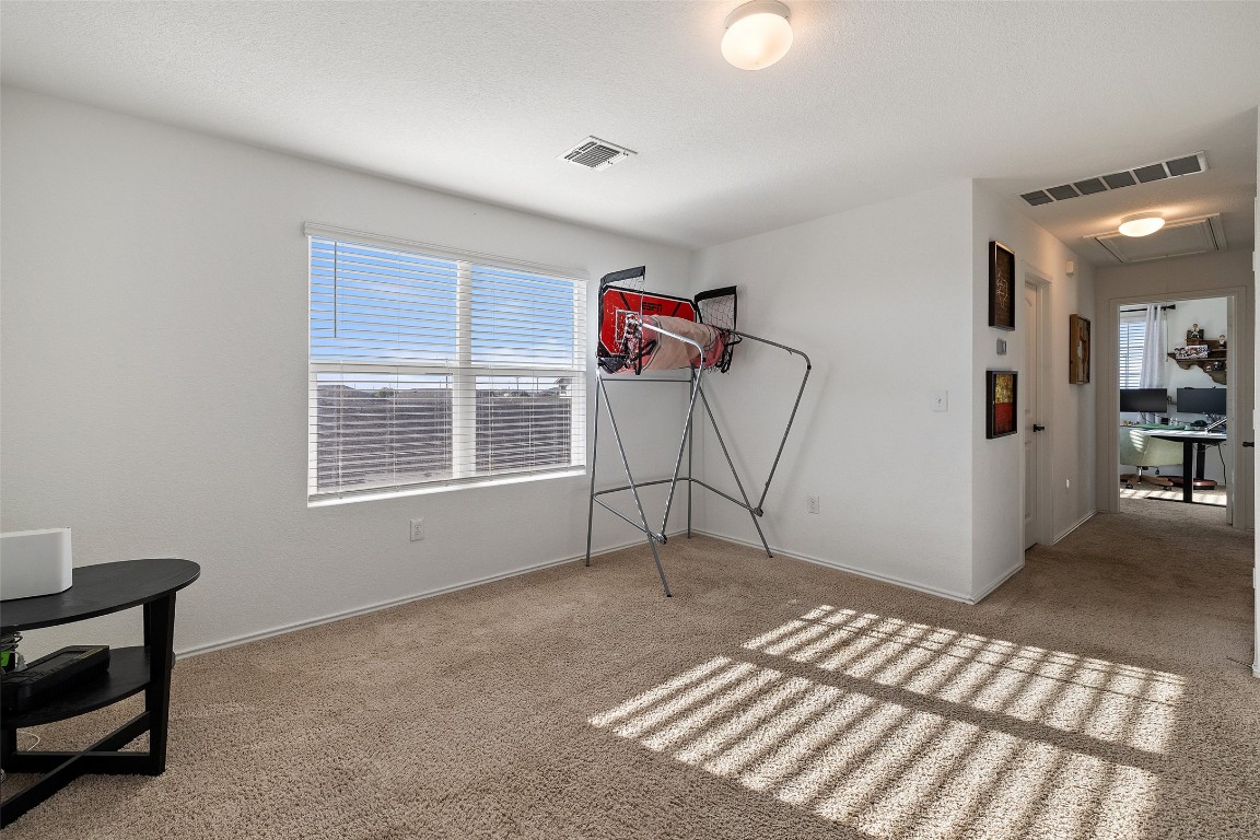 11801 Riprap Drive Manor, TX 78653 - Photo 30 of 40 a view of livingroom with furniture and windows