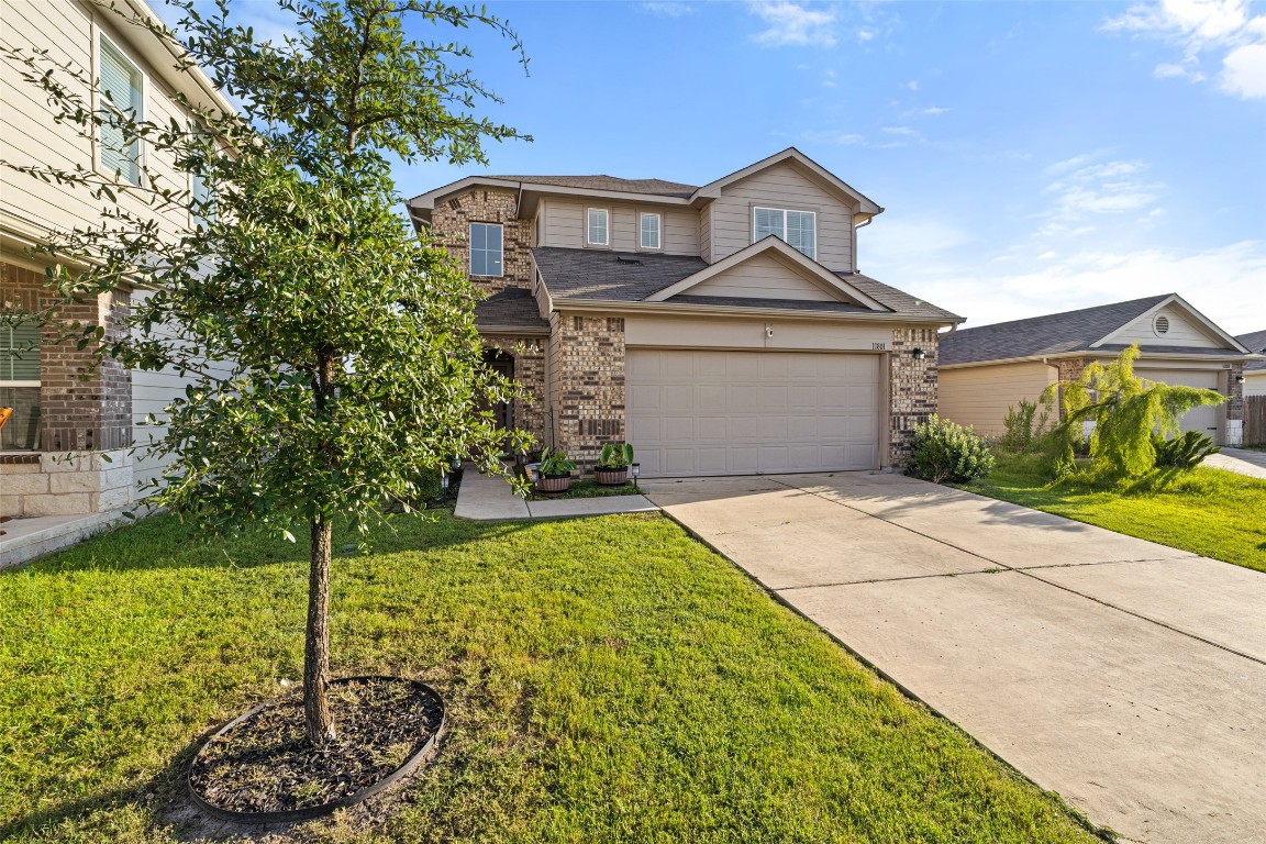 11801 Riprap Drive Manor, TX 78653 - Photo 3 of 40 a front view of a house with garden
