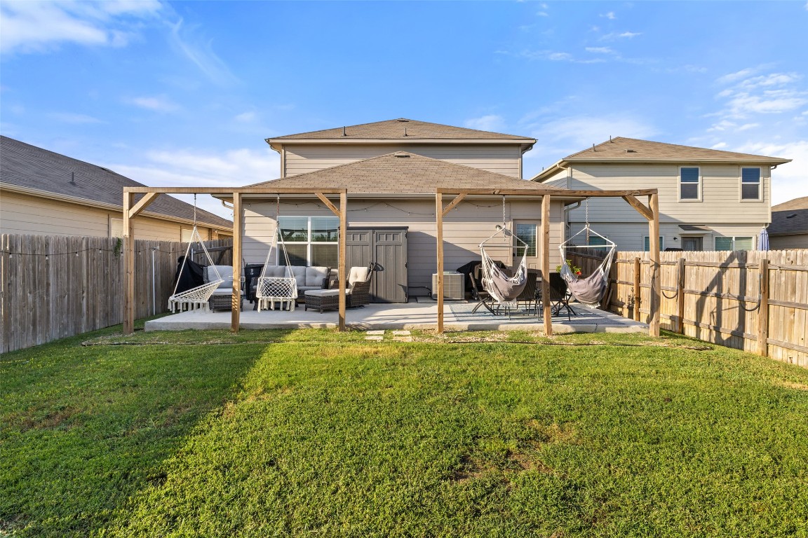 11801 Riprap Drive Manor, TX 78653 - Photo 39 of 40 a view of a house with backyard porch and sitting area