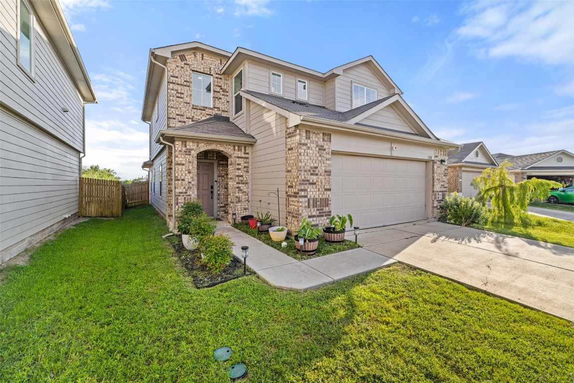 11801 Riprap Drive Manor, TX 78653 - Photo 4 of 40 a front view of a house with garden