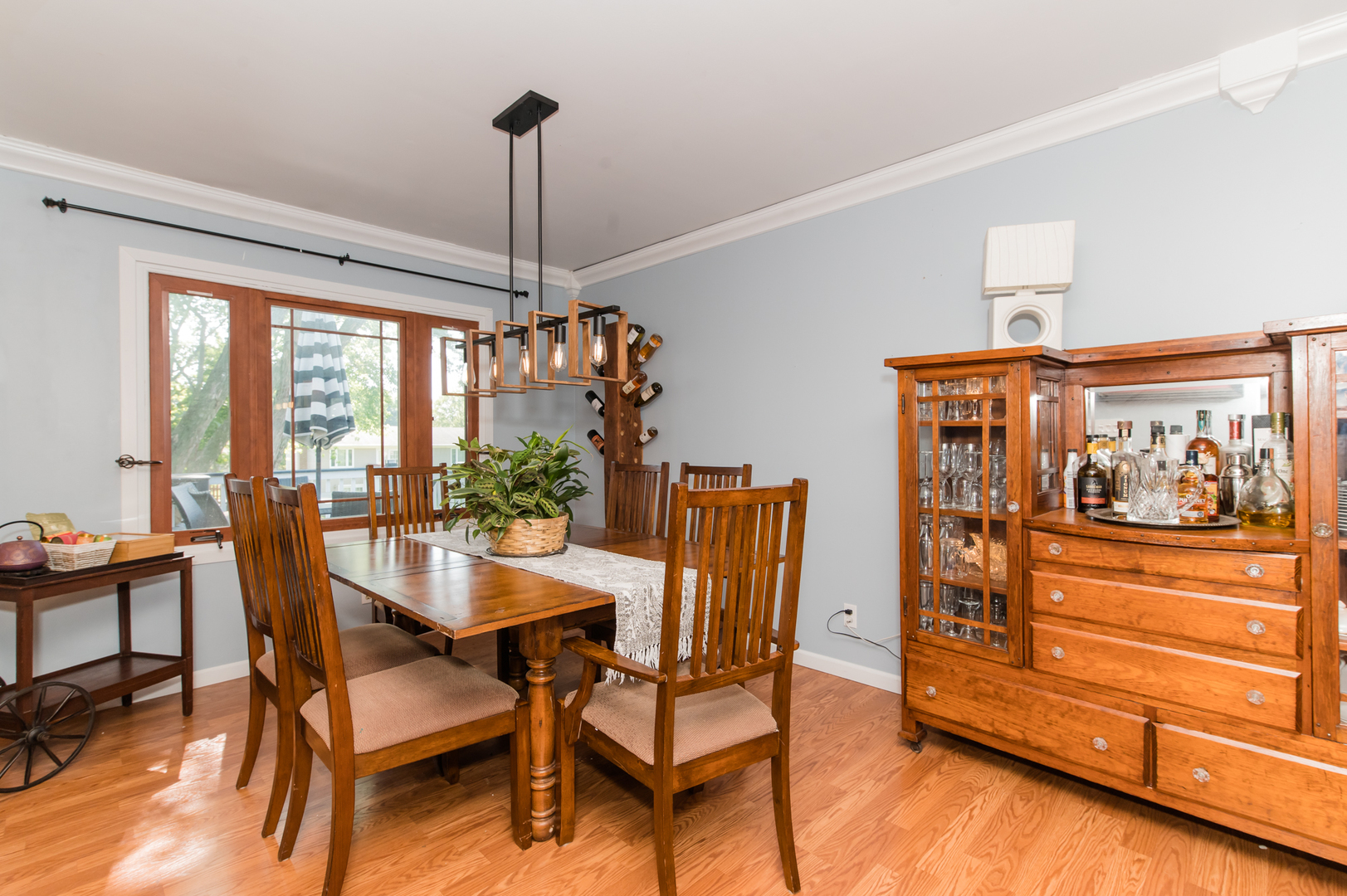 73 Fairfield Lane Cary, IL 60013 - Photo 12 of 33 a dining room with furniture a chandelier and wooden floor