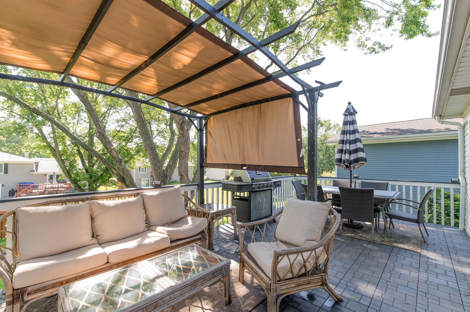73 Fairfield Lane Cary, IL 60013 - Photo 19 of 33 a view of a patio with a dining table and chairs with wooden floor and fence