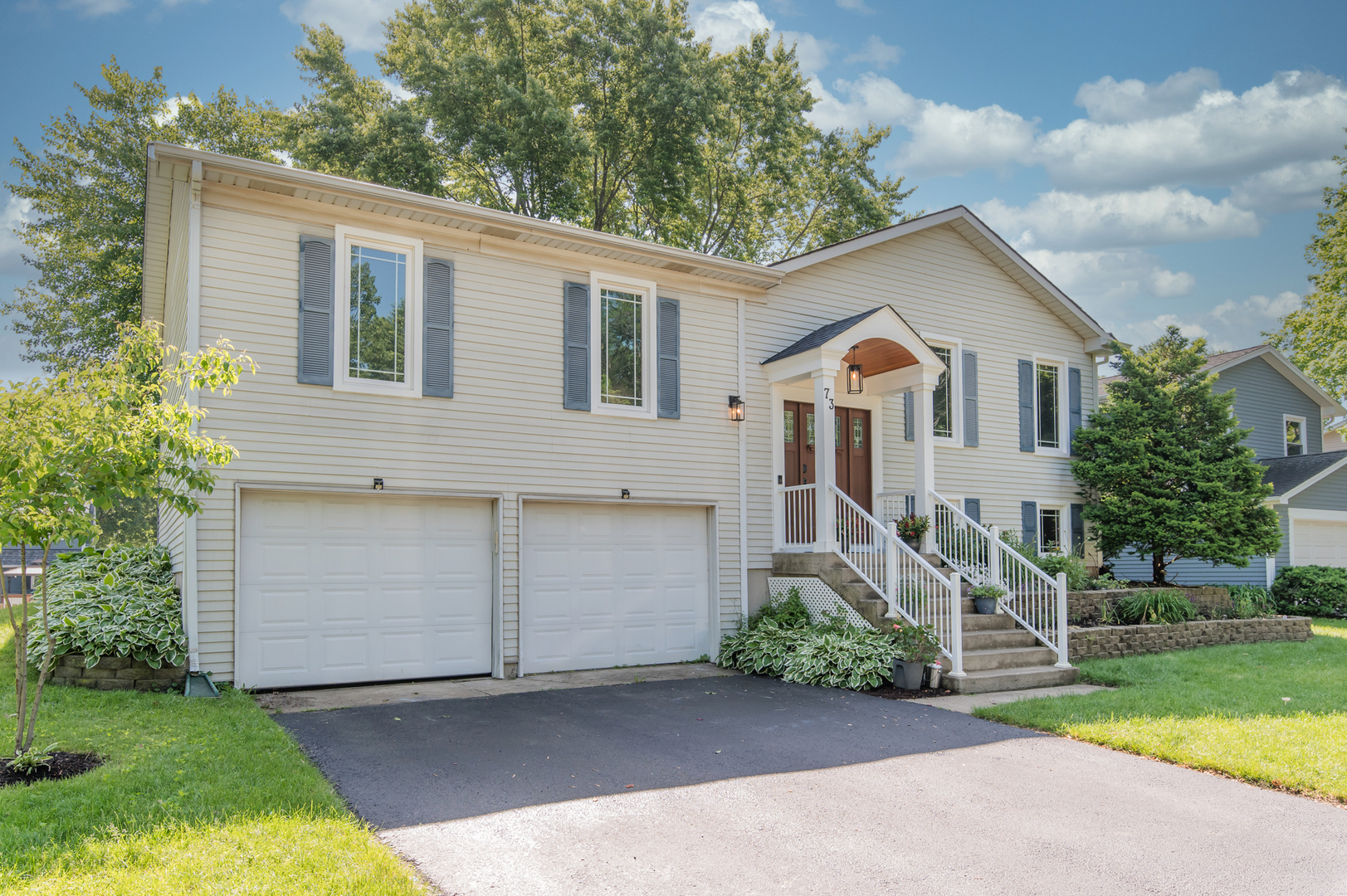 73 Fairfield Lane Cary, IL 60013 - Photo 2 of 33 a front view of a house with garden