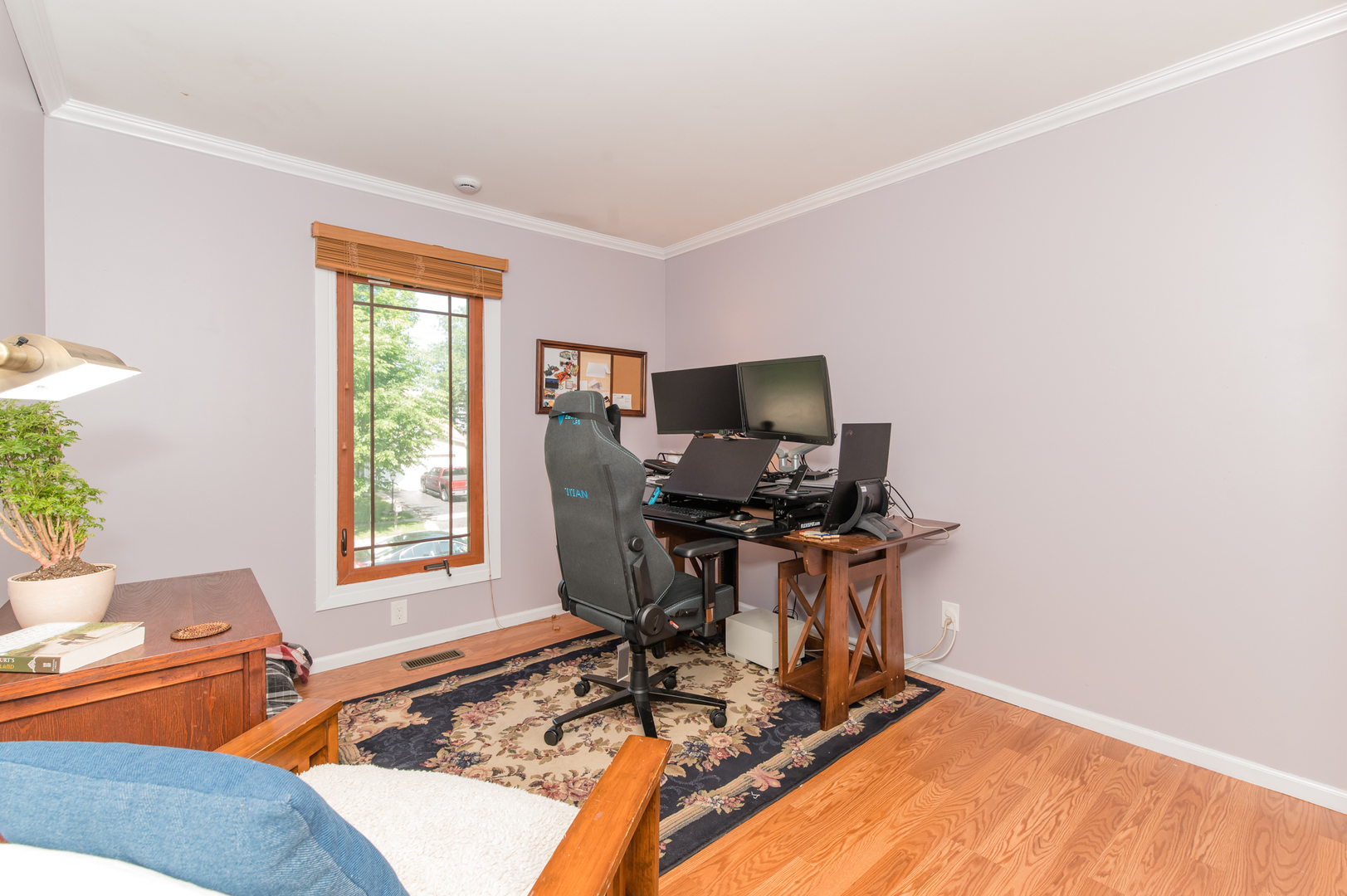 73 Fairfield Lane Cary, IL 60013 - Photo 22 of 33 a work room with furniture a flat screen tv and a window