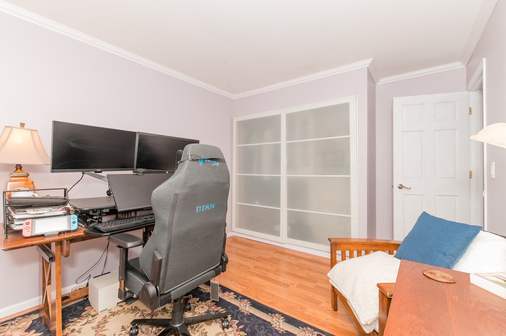 73 Fairfield Lane Cary, IL 60013 - Photo 24 of 33 a workspace with furniture and a flat screen tv