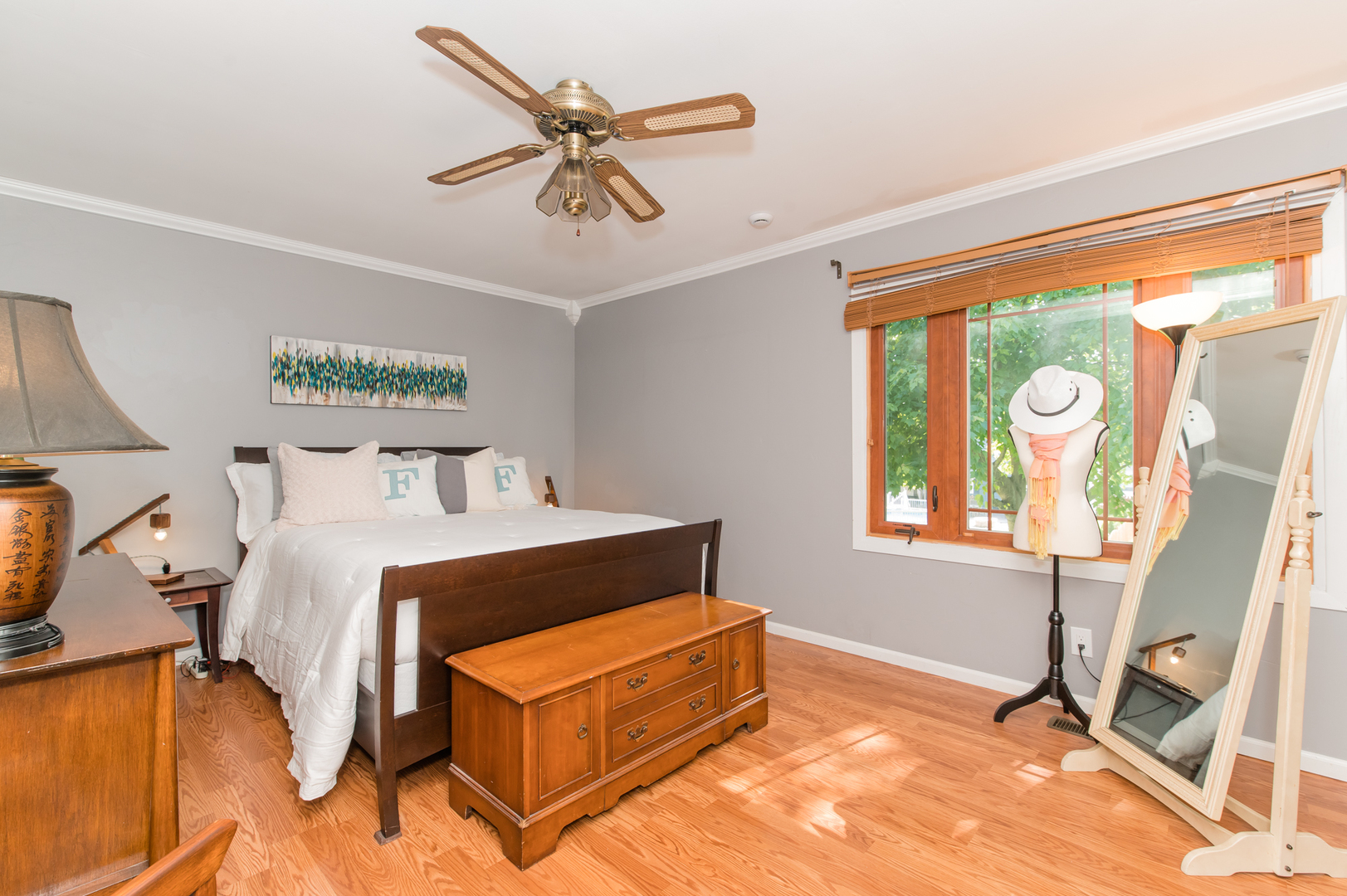 73 Fairfield Lane Cary, IL 60013 - Photo 25 of 33 a bedroom with a bed a chandelier and next to a window