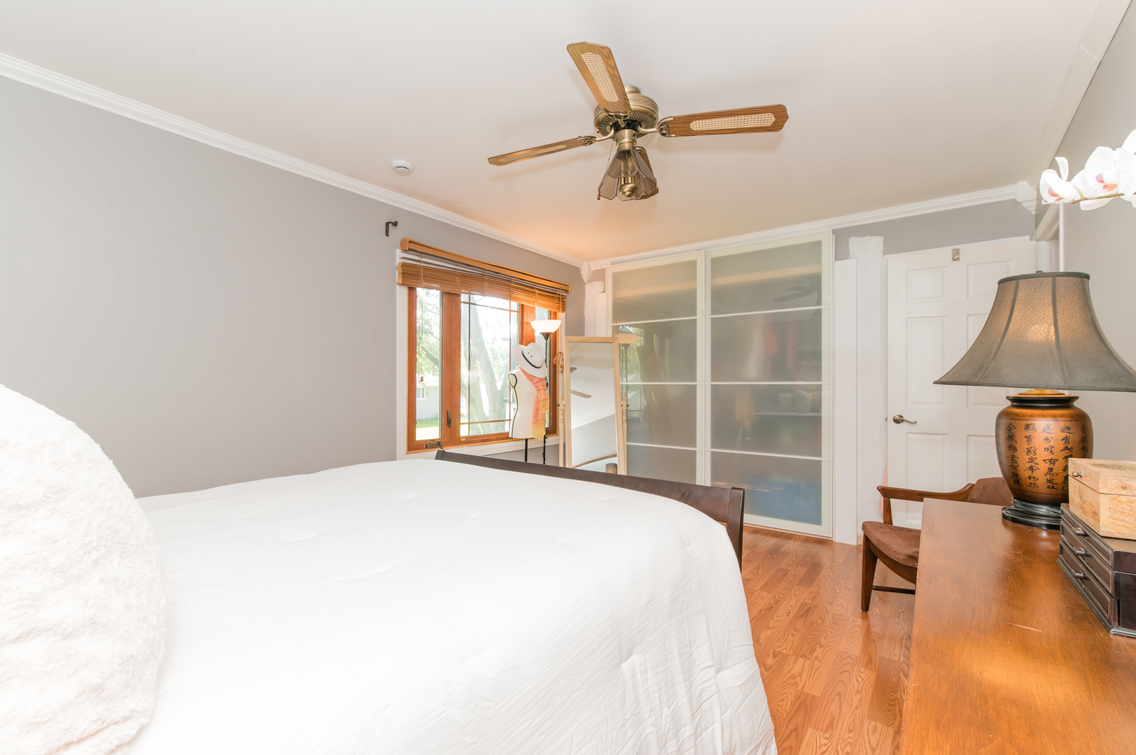 73 Fairfield Lane Cary, IL 60013 - Photo 27 of 33 a bedroom with a large bed and a chandelier