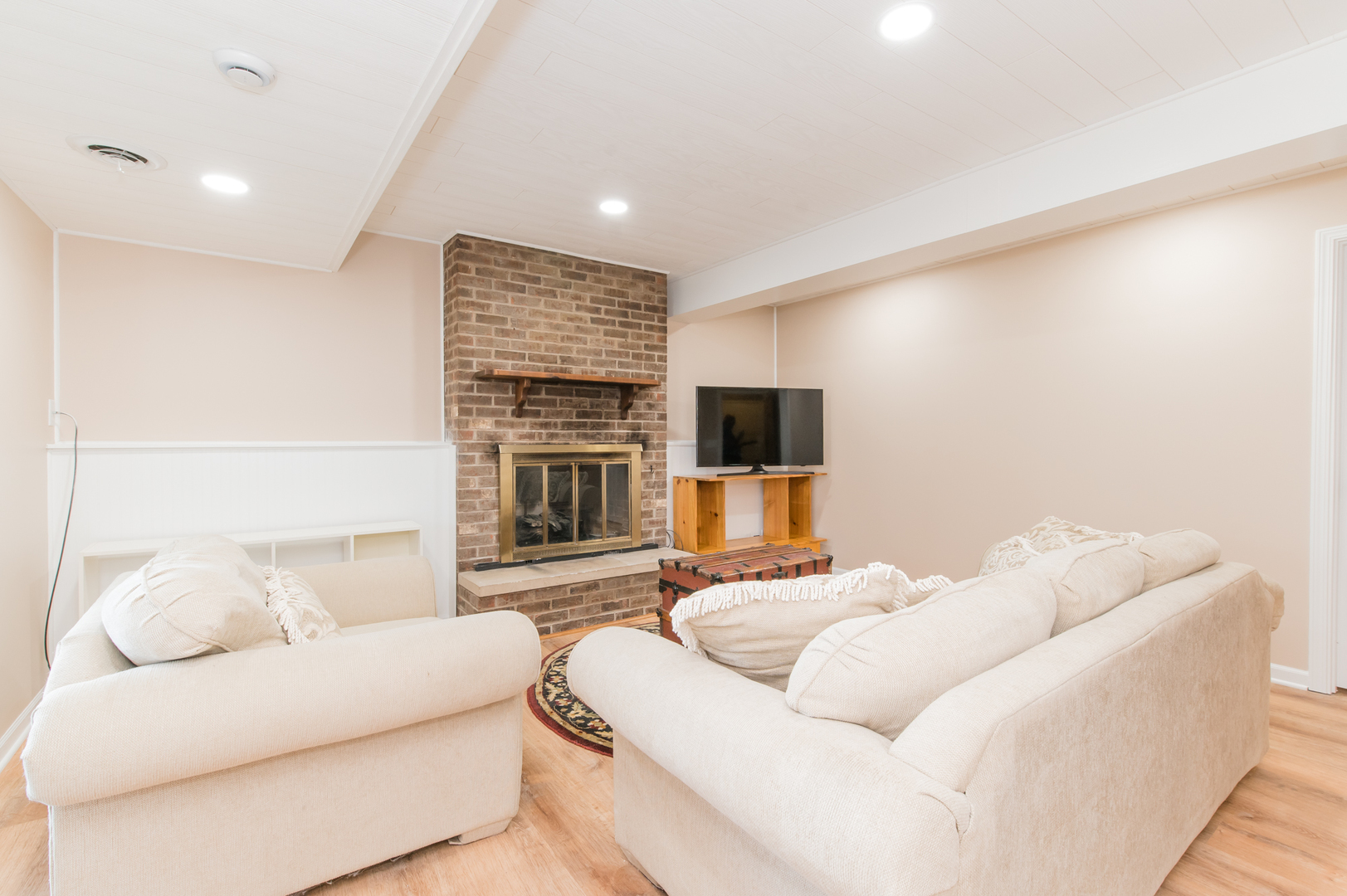 73 Fairfield Lane Cary, IL 60013 - Photo 32 of 33 a living room with furniture and a flat screen tv