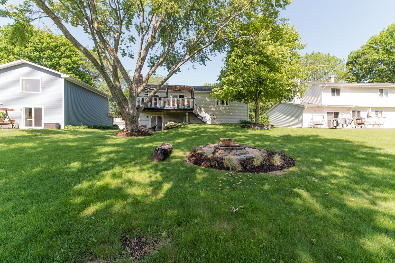 73 Fairfield Lane Cary, IL 60013 - Photo 5 of 33 a view of a house with a big yard and large trees
