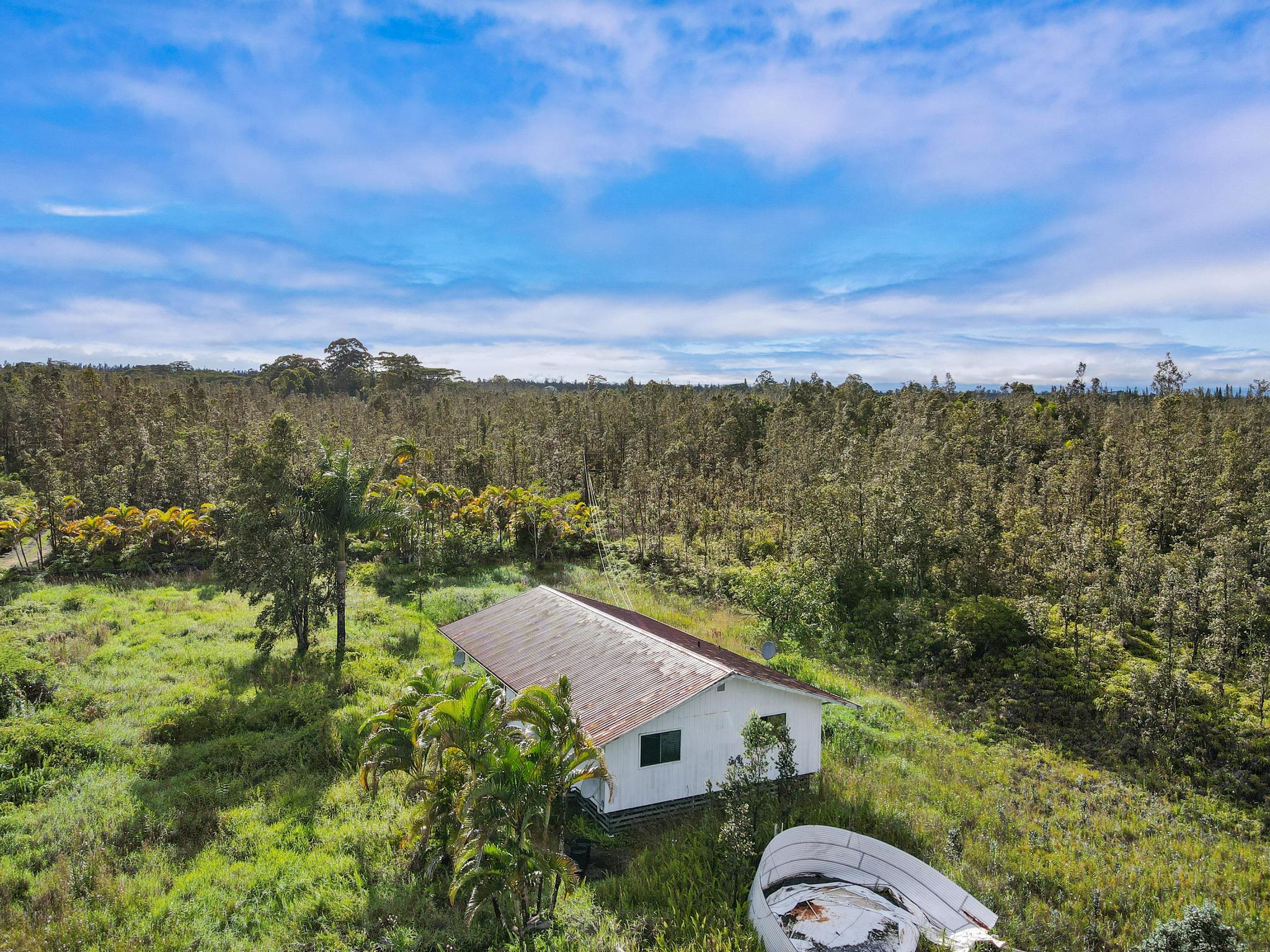 16-2071 Ao Rd Mountain View Pahoa, HI 96778 - Photo 12 of 13 aerial view of a house with a yard