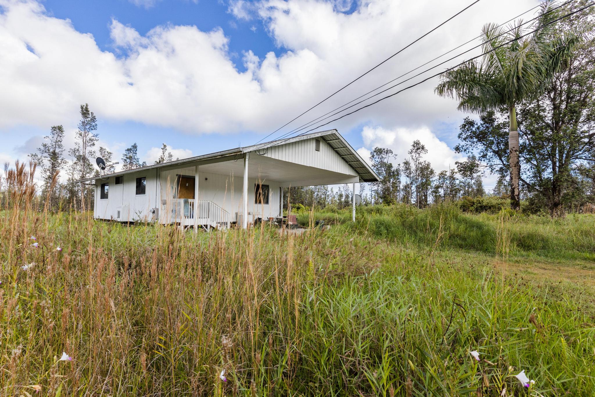 16-2071 Ao Rd Mountain View Pahoa, HI 96778 - Photo 3 of 13 a view of a house with a yard