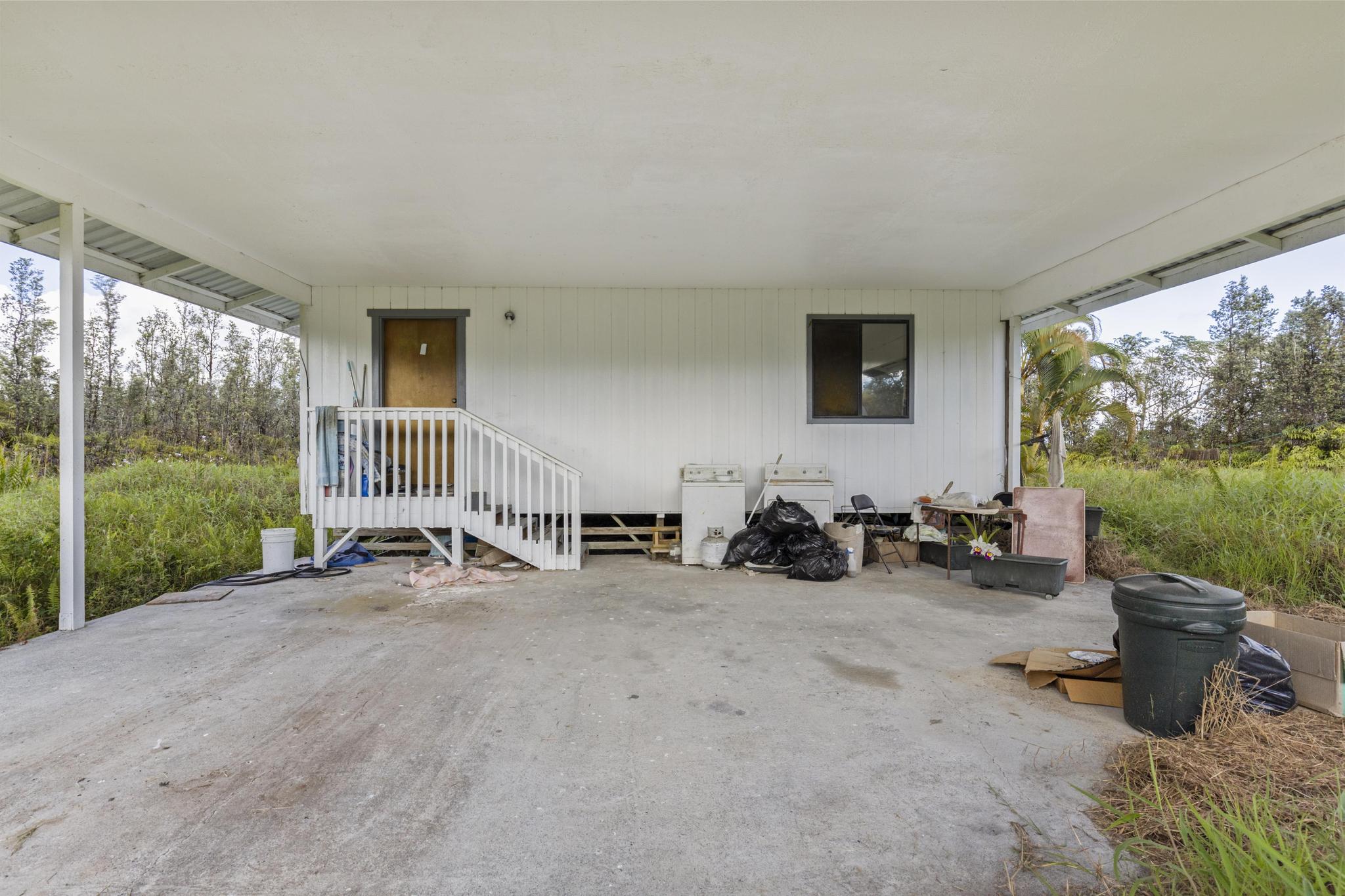 16-2071 Ao Rd Mountain View Pahoa, HI 96778 - Photo 4 of 13 a view of a room with gym equipment and a large window
