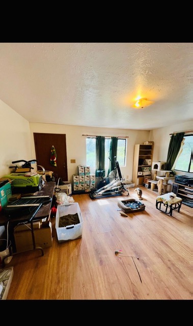 16-2071 Ao Rd Mountain View Pahoa, HI 96778 - Photo 5 of 13 a living room with furniture and a flat screen tv