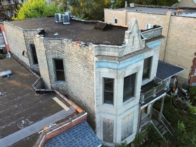 an aerial view of a houses with outdoor space